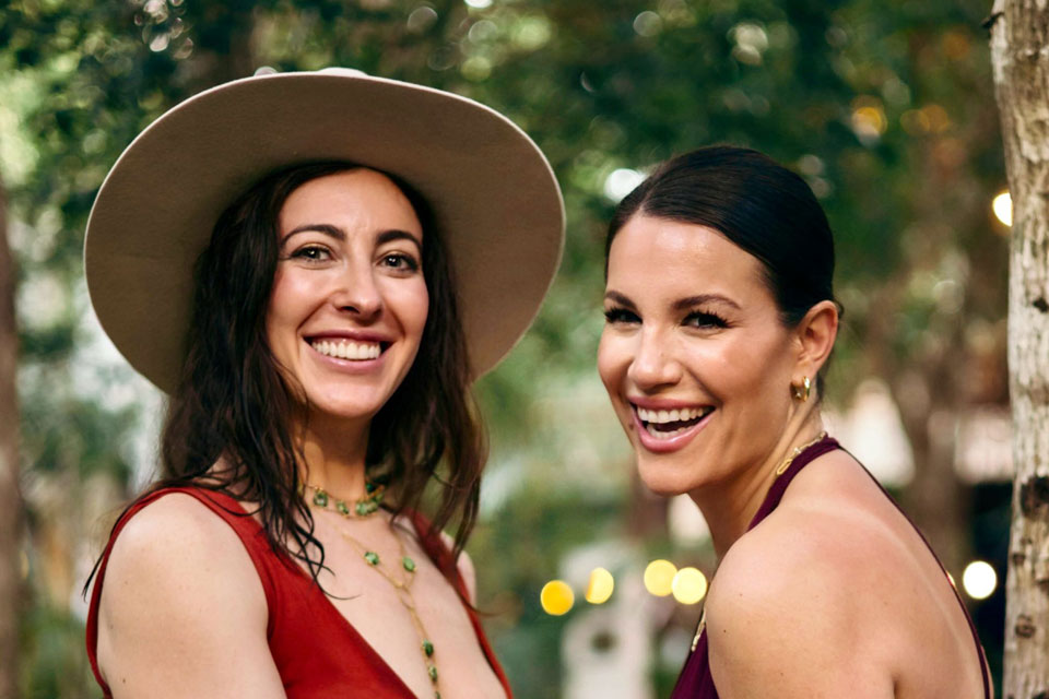 Katya Libin and Olivia Steele, co-founders of JADEVA, smiling during a gathering in nature.