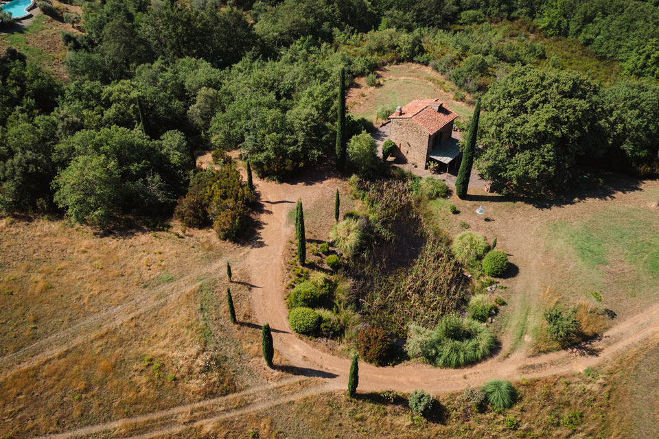 Detail of sustainable architecture using local Tuscan stone and wood.