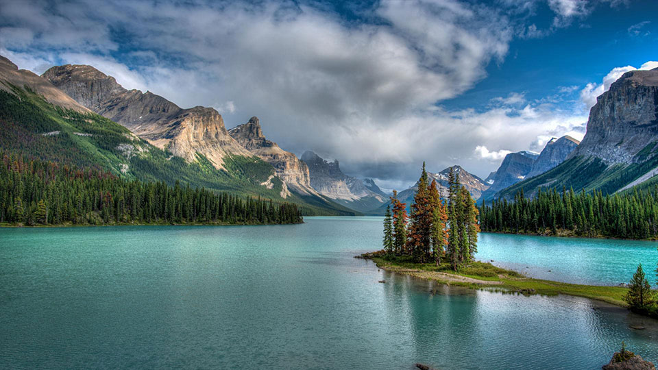 Maligne Lake in Jasper National Park offers a dramatic mountain setting for Northern Lights photography.